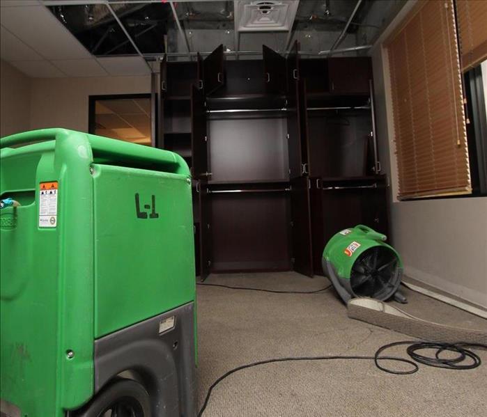 In this photo we are using the Axial Air Mover and the Dehumidifier to try and save this custom cabinetry from water damage.